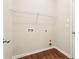 A simple laundry room offers functionality and storage space at 72 Fern Walk, Lawrenceville, GA 30045