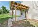 Covered wooden pergola creates an ideal shaded retreat within the backyard space at 72 Fern Walk, Lawrenceville, GA 30045