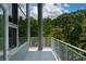 Balcony with white railing and scenic views of lush green trees and blue sky at 850 Ralph Mcgill Ne Blvd # 6, Atlanta, GA 30306