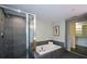 Stylish bathroom features tiled shower and soaking tub and is located next to the walk-in closet at 850 Ralph Mcgill Ne Blvd # 6, Atlanta, GA 30306