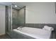 Modern bathroom features tiled shower, a luxurious soaking tub and neatly folded towels at 850 Ralph Mcgill Ne Blvd # 6, Atlanta, GA 30306
