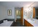Bright bathroom features modern vanity, a bathtub and an open door to a walk-in closet at 850 Ralph Mcgill Ne Blvd # 6, Atlanta, GA 30306