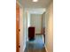 Hallway featuring neutral walls, modern lighting, and a view of a classic wooden dresser at 850 Ralph Mcgill Ne Blvd # 6, Atlanta, GA 30306