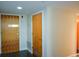 Hallway featuring two wooden doors and modern design, with a glimpse of an orange door at 850 Ralph Mcgill Ne Blvd # 6, Atlanta, GA 30306