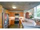 Bright kitchen featuring stainless steel appliances, light wood cabinets, and concrete ceiling at 850 Ralph Mcgill Ne Blvd # 6, Atlanta, GA 30306