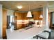 Modern kitchen with stainless steel appliances, wooden cabinets, a breakfast bar and concrete ceiling at 850 Ralph Mcgill Ne Blvd # 6, Atlanta, GA 30306