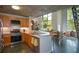 Stylish kitchen featuring a breakfast bar, stainless steel appliances, wood cabinets, and a concrete ceiling at 850 Ralph Mcgill Ne Blvd # 6, Atlanta, GA 30306