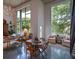 Bright living room featuring large windows, chandelier, and a seating area with a round table and concrete floors at 850 Ralph Mcgill Ne Blvd # 6, Atlanta, GA 30306