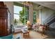 Spacious living room showcasing a large window, concrete ceiling, and cozy seating, accented with unique decor at 850 Ralph Mcgill Ne Blvd # 6, Atlanta, GA 30306