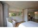 Comfortable bedroom with neutral tones, concrete accents, natural light, and an inviting seating area at 850 Ralph Mcgill Ne Blvd # 6, Atlanta, GA 30306