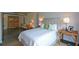 Inviting bedroom featuring concrete floors, a plush bed, warm lighting, and stylish furnishings at 850 Ralph Mcgill Ne Blvd # 6, Atlanta, GA 30306