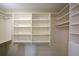 Bright walk-in closet with many built-in shelves and hanging rods for optimal clothing and accessory storage at 850 Ralph Mcgill Ne Blvd # 6, Atlanta, GA 30306