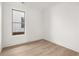 Cozy bedroom with wood floors, neutral paint, and a window with a view at 1659 Tielman Way, Snellville, GA 30078