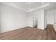 Spacious bedroom features hardwood floors, recessed lighting, and neutral paint scheme at 1659 Tielman Way, Snellville, GA 30078