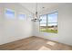 Light-filled dining room featuring three windows offering plenty of natural light at 1659 Tielman Way, Snellville, GA 30078
