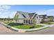 Stunning new construction features beautiful landscaping, a covered front porch, and neutral-colored exterior at 1659 Tielman Way, Snellville, GA 30078