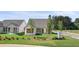 Charming home featuring a well-maintained front yard, a neat lawn, and landscaping at 1659 Tielman Way, Snellville, GA 30078