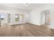 Bright living room featuring a neutral color palette and large windows with natural light at 1659 Tielman Way, Snellville, GA 30078