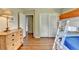 Bedroom with bunk beds, hardwood floors, closet and view of ensuite bathroom at 1744 Chateau Dr, Dunwoody, GA 30338
