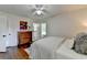 Bedroom with hardwood floors, closet, dresser, and ensuite bathroom at 1744 Chateau Dr, Dunwoody, GA 30338