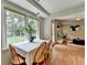 Bright breakfast area offers natural light and a view of the backyard and an adjacent fireplace at 1744 Chateau Dr, Dunwoody, GA 30338
