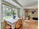 Bright dining area features hardwood floors, large windows, and natural light at 1744 Chateau Dr, Dunwoody, GA 30338