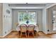 Cozy dining area with hardwood floors, large windows and charming decor at 1744 Chateau Dr, Dunwoody, GA 30338