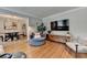Open living room with hardwood floors with view to the dining room area at 1744 Chateau Dr, Dunwoody, GA 30338