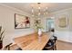 Elegant dining room featuring hardwood floors, modern lighting and stylish accents at 1744 Chateau Dr, Dunwoody, GA 30338