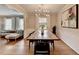 Elegant dining room featuring modern chandelier, hardwood floors, and stylish decor at 1744 Chateau Dr, Dunwoody, GA 30338