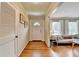 Inviting home entryway featuring gleaming wood floors, a convenient coat closet, and a view into the living room at 1744 Chateau Dr, Dunwoody, GA 30338