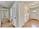 Hallway with hardwood floors and closet space at 1744 Chateau Dr, Dunwoody, GA 30338