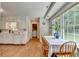 Bright kitchen boasts hardwood floors, natural light, and an adjacent dining area at 1744 Chateau Dr, Dunwoody, GA 30338