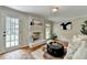 Living room with fireplace, french doors, and stylish decor at 1744 Chateau Dr, Dunwoody, GA 30338