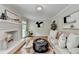 Cozy living room featuring a fireplace, hardwood floors, and comfortable seating at 1744 Chateau Dr, Dunwoody, GA 30338