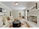Inviting living room boasts a brick fireplace, hardwood floors, and comfortable seating at 1744 Chateau Dr, Dunwoody, GA 30338