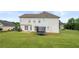 View of the backyard highlighting the lawn, patio, and a trampoline at 2127 Grant Ave, Mcdonough, GA 30252