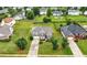 Charming brick-and-siding home featuring a well-manicured lawn and beautiful landscaping at 2127 Grant Ave, Mcdonough, GA 30252