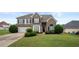Charming two-story home featuring a well-manicured lawn and inviting curb appeal at 2127 Grant Ave, Mcdonough, GA 30252