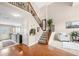 Inviting foyer with hardwood floors, staircase, and open view to the living area at 2127 Grant Ave, Mcdonough, GA 30252