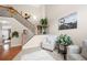 Inviting foyer with hardwood floors, staircase, and open view to the living area at 2127 Grant Ave, Mcdonough, GA 30252