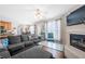Open-concept living area with cozy fireplace and a sectional sofa at 2127 Grant Ave, Mcdonough, GA 30252