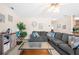 Spacious living room with sectional sofa, decor, and adjacent open kitchen at 2127 Grant Ave, Mcdonough, GA 30252