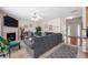 Open-concept living area with fireplace and adjoining entry at 2127 Grant Ave, Mcdonough, GA 30252