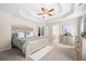 Bright and airy main bedroom suite with a decorative tray ceiling and neutral color palette at 2127 Grant Ave, Mcdonough, GA 30252