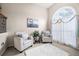 Bright sitting area with plush armchairs, a large window, and elegant decor at 2127 Grant Ave, Mcdonough, GA 30252