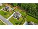 An aerial view shows a well-landscaped house with a private pool, surrounded by mature trees and green lawns at 355 Glynnwilde Nw Dr, Marietta, GA 30064