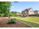 Expansive fenced backyard with lush greenery, offering privacy and space for outdoor activities at 355 Glynnwilde Nw Dr, Marietta, GA 30064