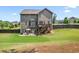 Spacious backyard with a patio and wooden deck, ideal for outdoor gatherings and enjoying the serene surroundings at 355 Glynnwilde Nw Dr, Marietta, GA 30064