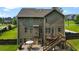 Backyard showcasing a spacious deck, stone patio, and a lush lawn perfect for outdoor enjoyment at 355 Glynnwilde Nw Dr, Marietta, GA 30064